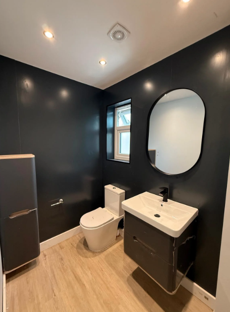 Dark modern bathroom renovation London